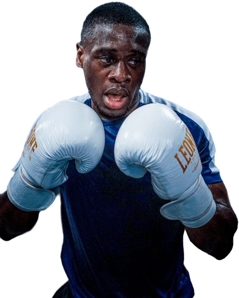 A man with boxing gloves [📷: Thomas Ronveaux from pexels.com]