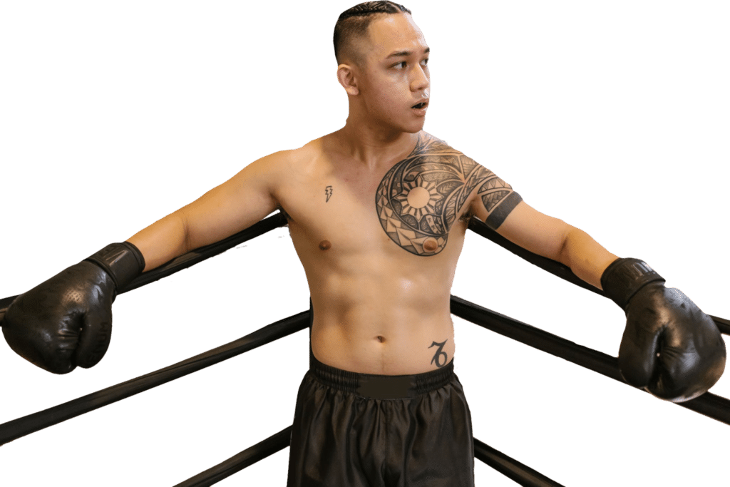 Man wearing boxing gloves standing in the corner of the ring [📷: RDNE Stock project from pexels.com]